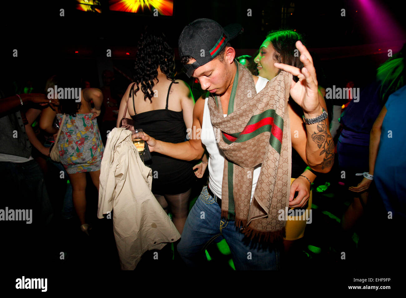 Guy dancing in a designer scarf at La Bomba at MOS 3rd Sept 09 Stock Photo Alamy
