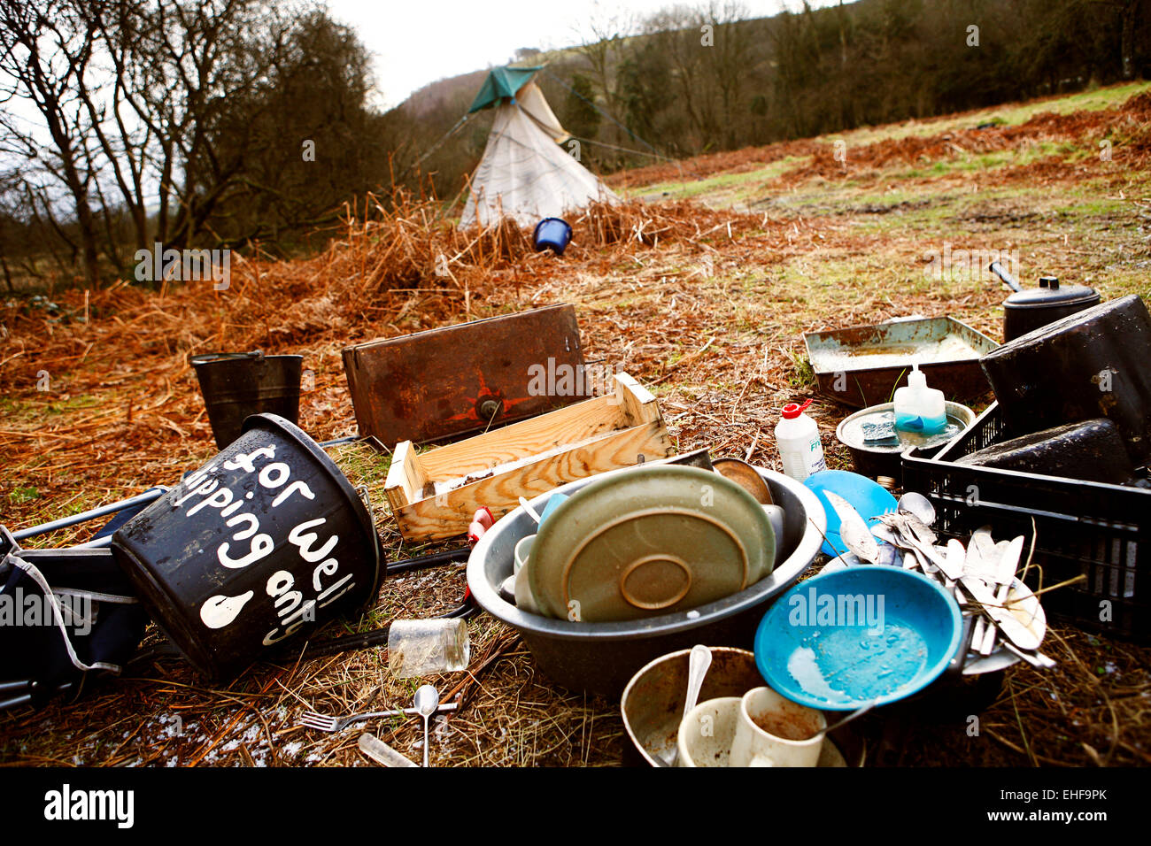 Washing up outside a tipi at Tipi Valley an eco community near Talley in Wales. Stock Photo
