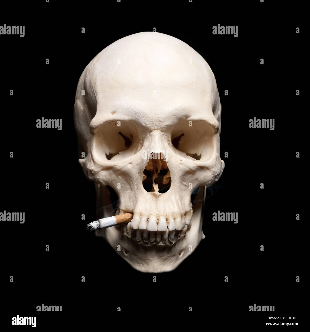 Danger Symbol. Human scull with cigarette Stock Photo