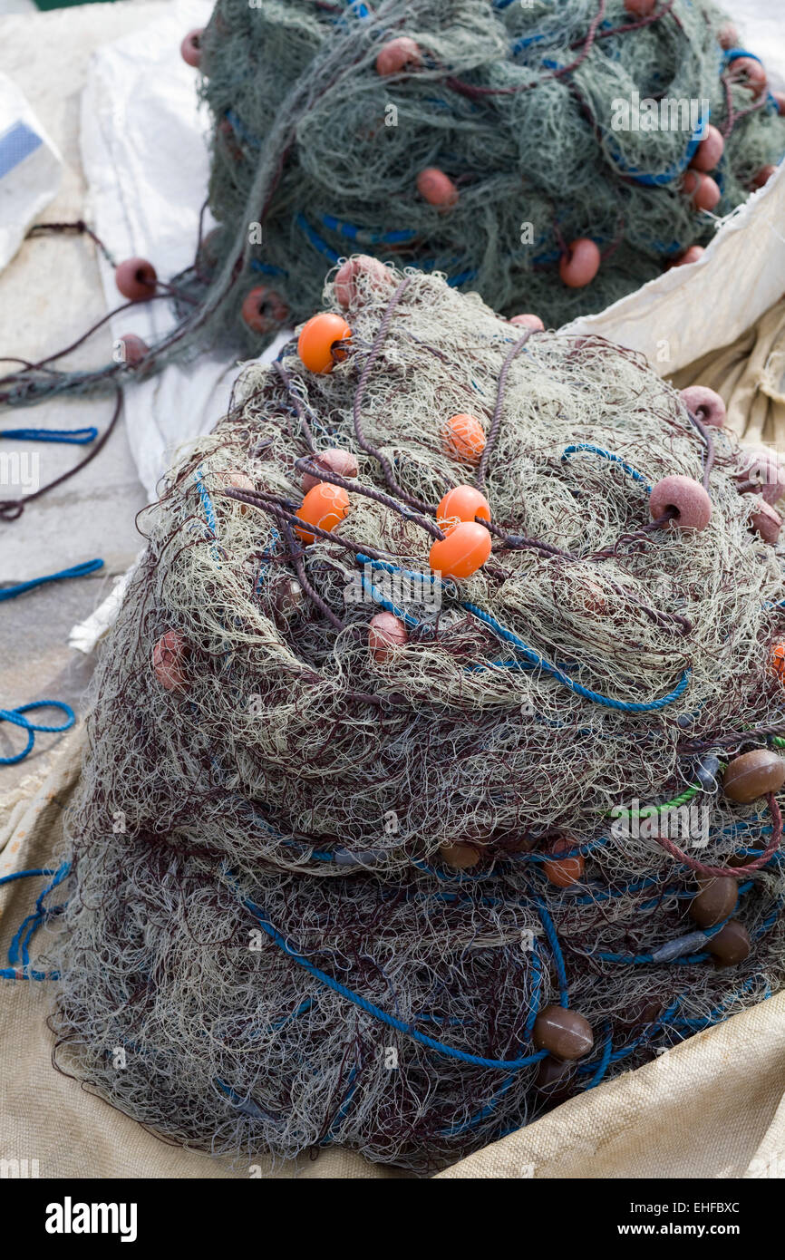 https://c8.alamy.com/comp/EHFBXC/nylon-fishing-net-with-float-line-attached-to-small-plastic-floats-EHFBXC.jpg