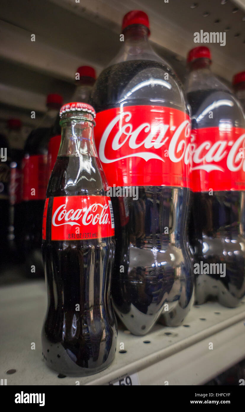 https://c8.alamy.com/comp/EHFCYF/an-iconic-trademarked-bottle-of-coca-cola-on-a-supermarket-shelf-in-EHFCYF.jpg