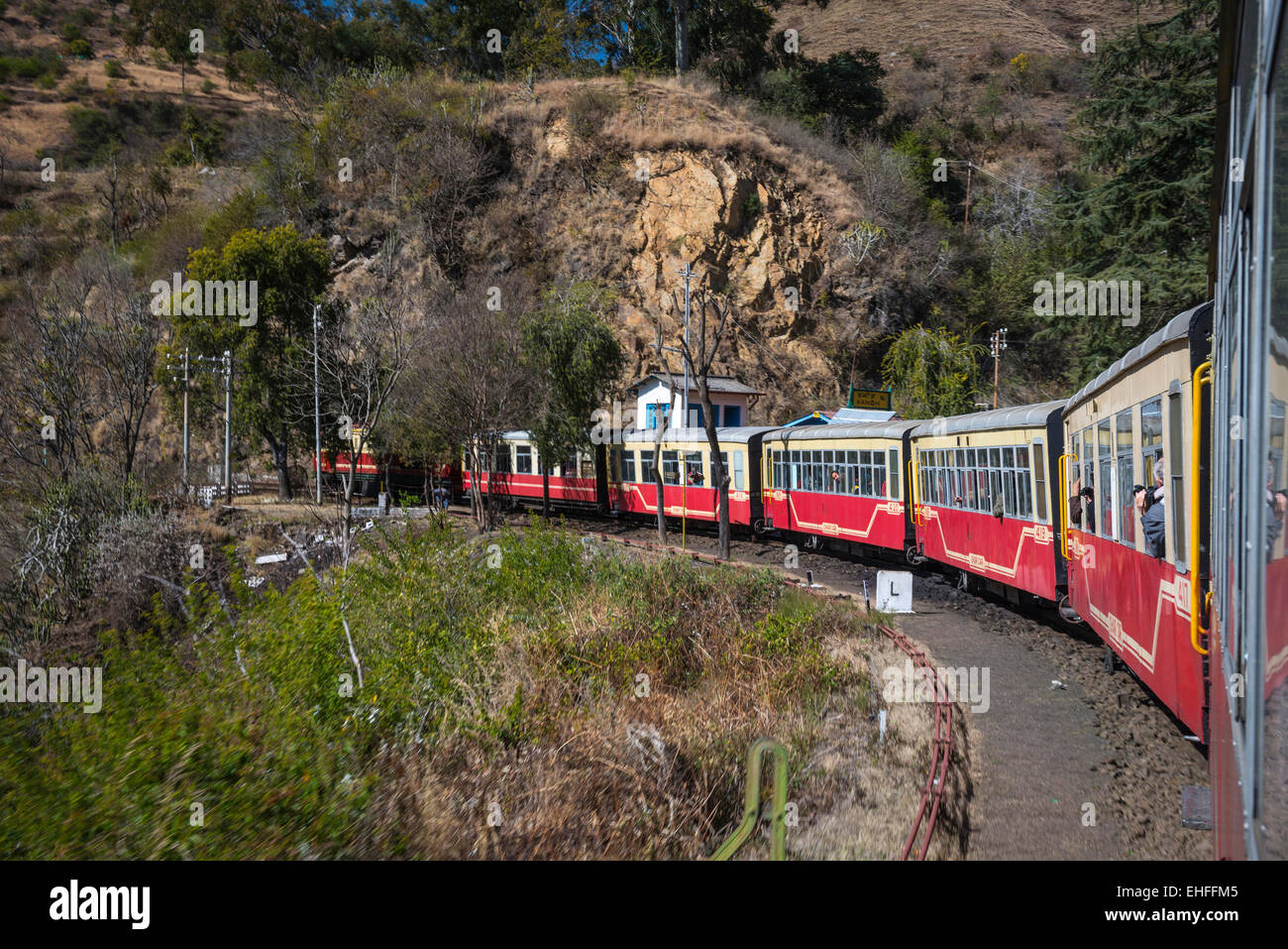 The narrow gauge Kalka-Shimla train winding down through the Himalayan foothills in India Stock Photo