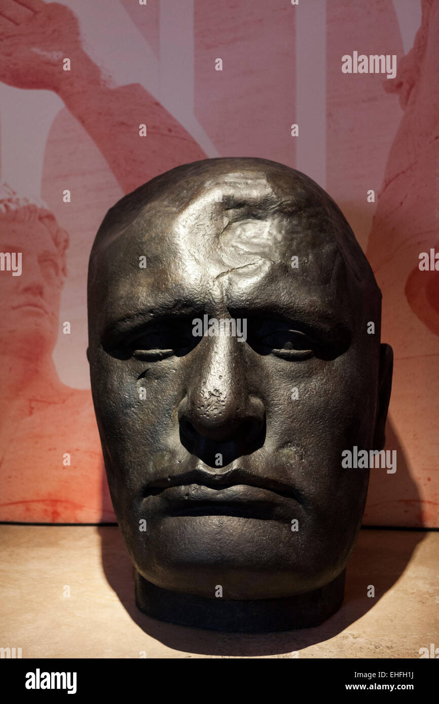 Bronze head of Benito Mussolini with damage to skull similar to injuries inflicted after death Stock Photo