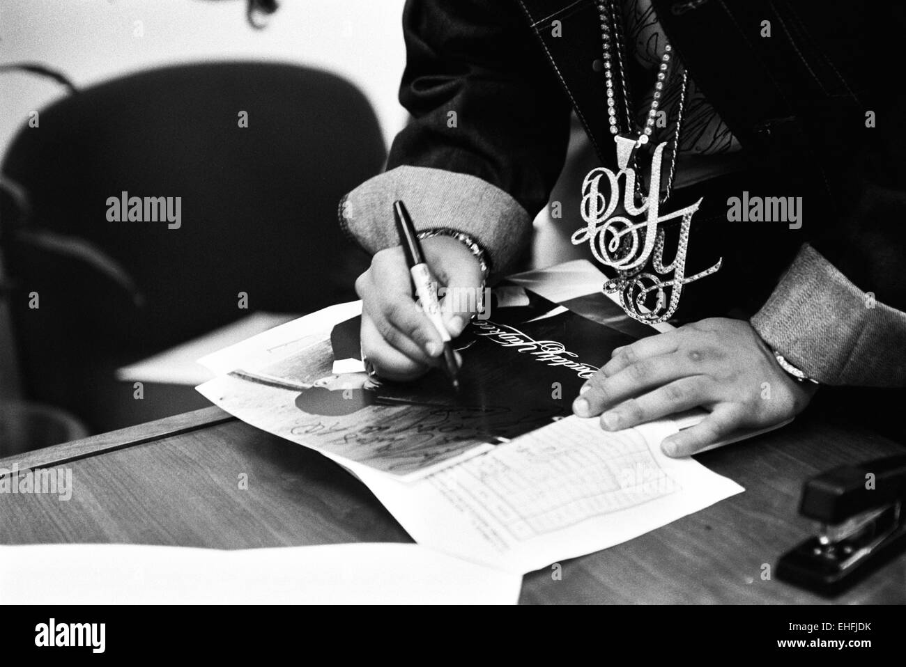 Daddy Yankee signing autographs at a radio station in San Juan Puerto