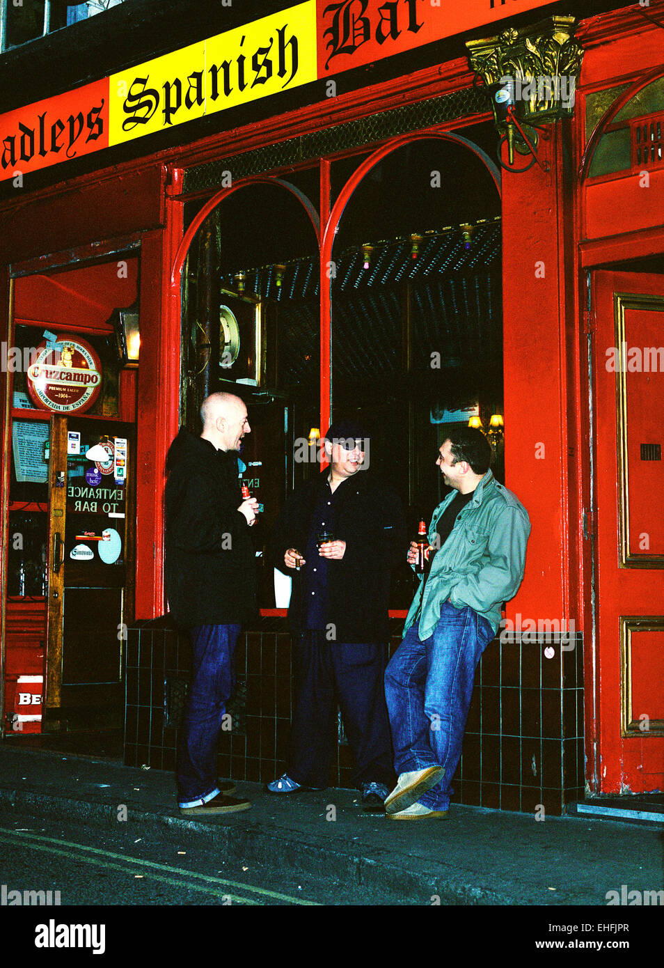 Portrait of the Que Rico boys outside a bar in London. Stock Photo