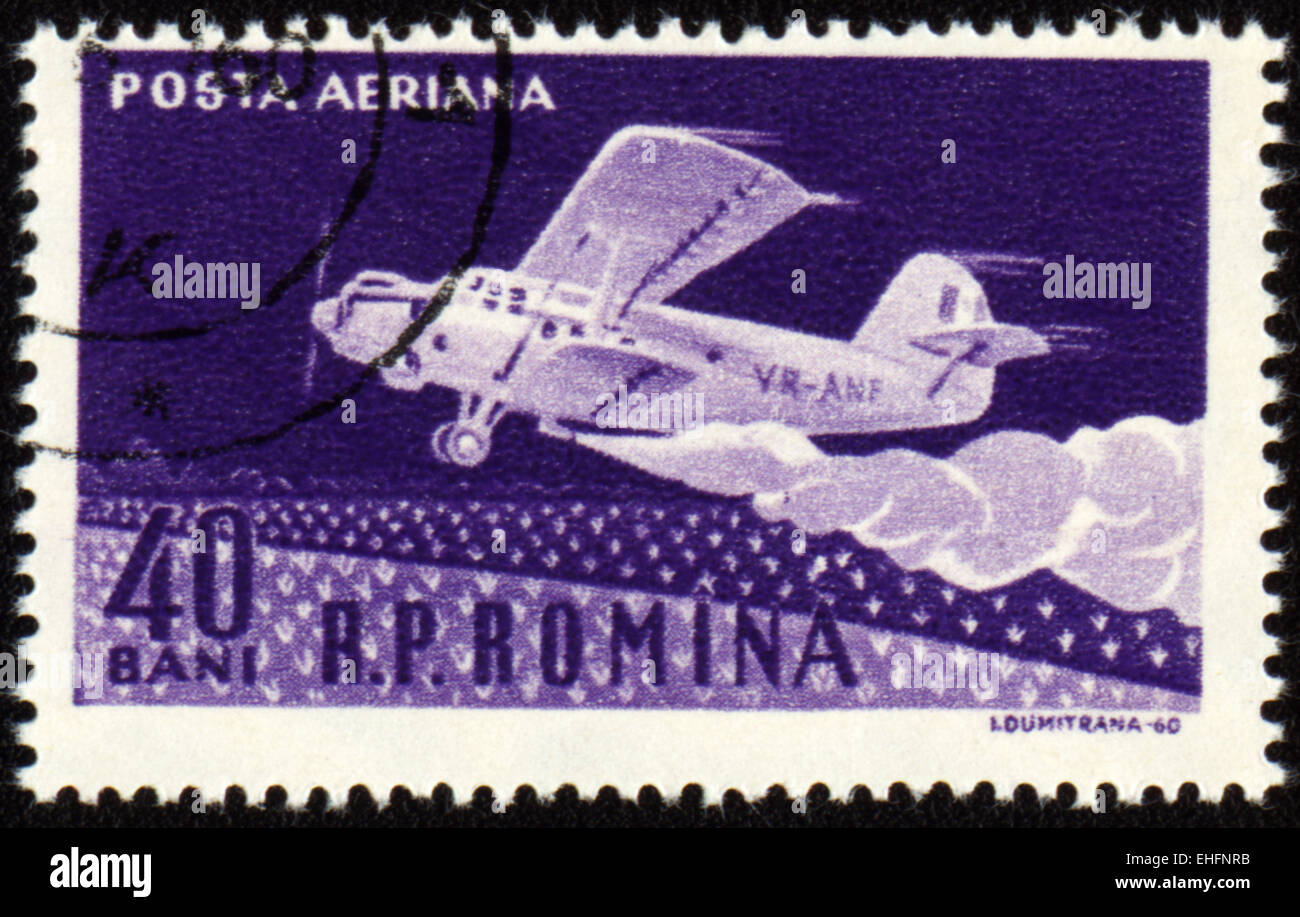 ROMANIA - CIRCA 1960: A stamp printed in Romania shows climb of old airplane AN-2 Stock Photo
