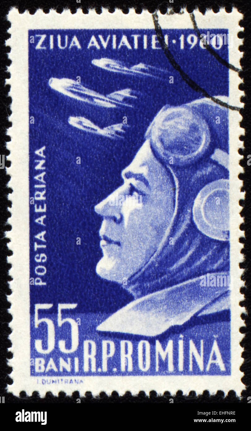 ROMANIA - CIRCA 1960: A stamp printed in Romania shows military flyer and flying planes on Aviation Day Stock Photo