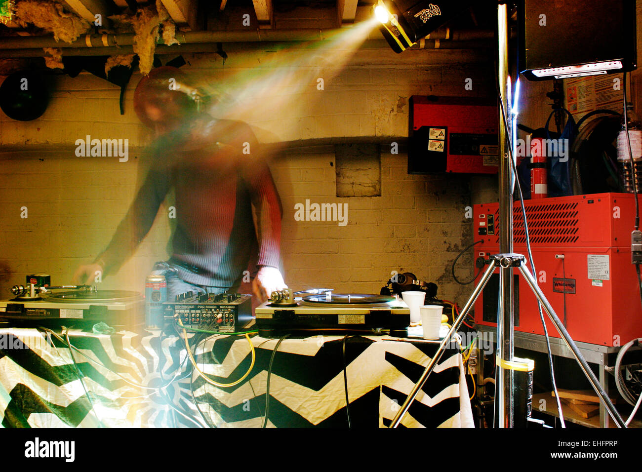 Ghostly image of DJ at a squat party in South East London. Stock Photo