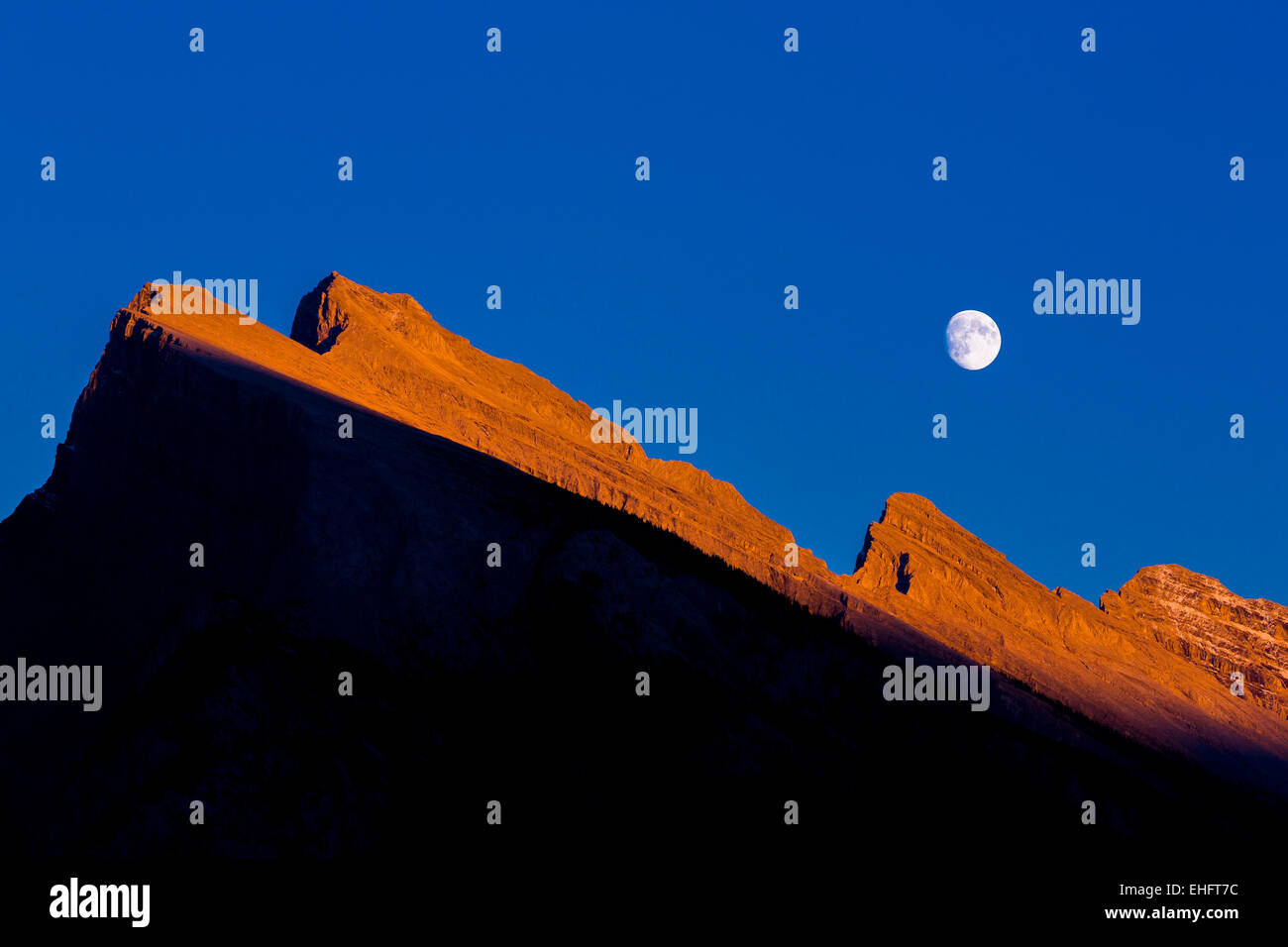 Moonrise over Mount Rundle, Banff National Park, Alberta Stock Photo