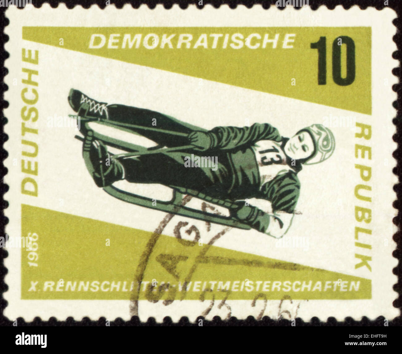 GDR - CIRCA 1966: A stamp printed in GDR (East Germany) shows descent to sledge Stock Photo