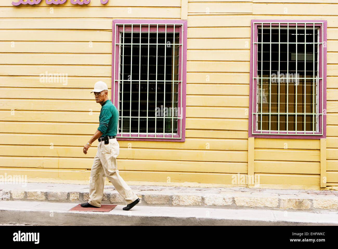 Old man walking down the street in St Johns Antigua. Stock Photo