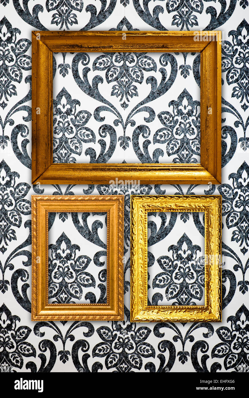 Gold frame on vintage wallpaper background Stock Photo - Alamy