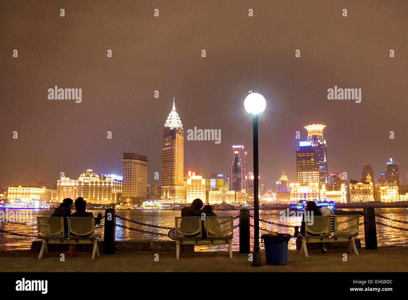 Couples spend a romantic evening taking in the Bund skyline Shanghai. Stock Photo