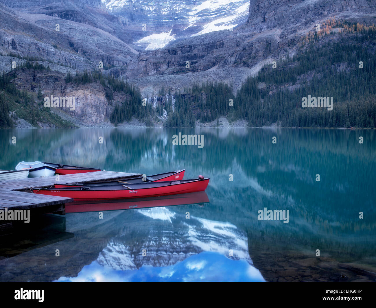 Lake O'hara with red canoes. Yoho National Park, Opabin Plateau, British Columbia, Canada Stock Photo