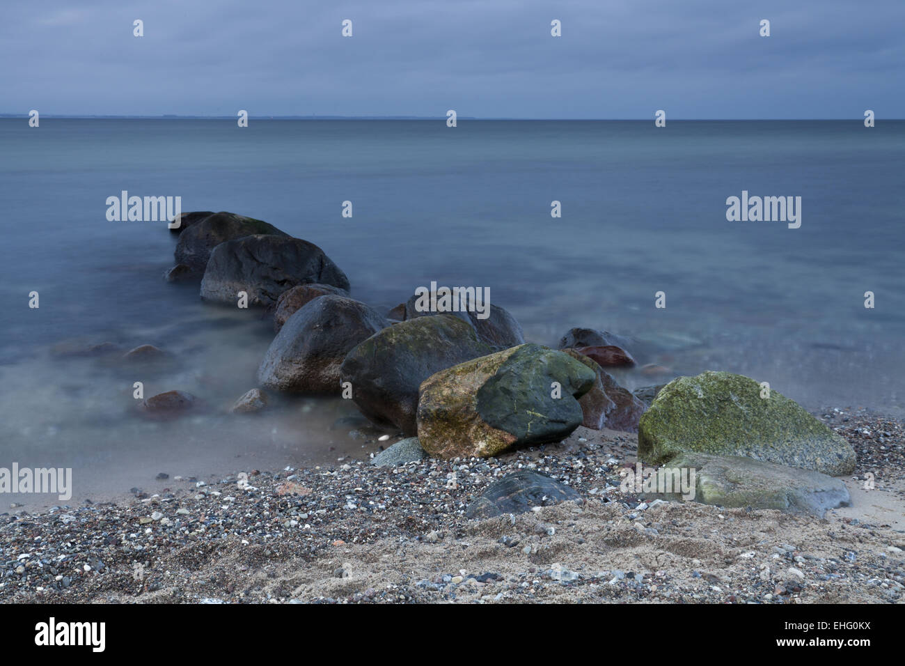 Rock on the steep bank Brodtener Stock Photo