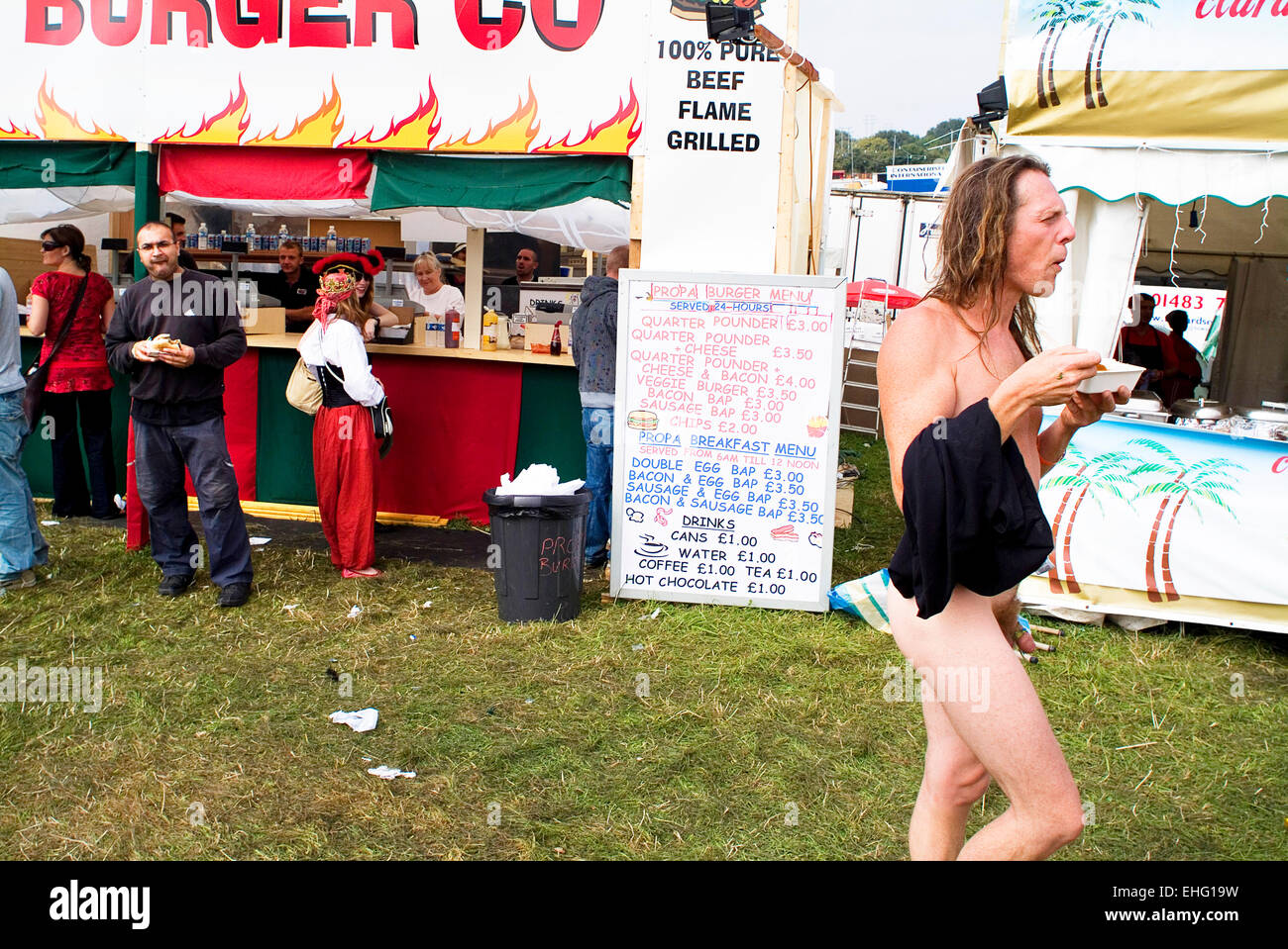 Man walking around naked at Bestival on the Isle of Wight Stock Photo -  Alamy