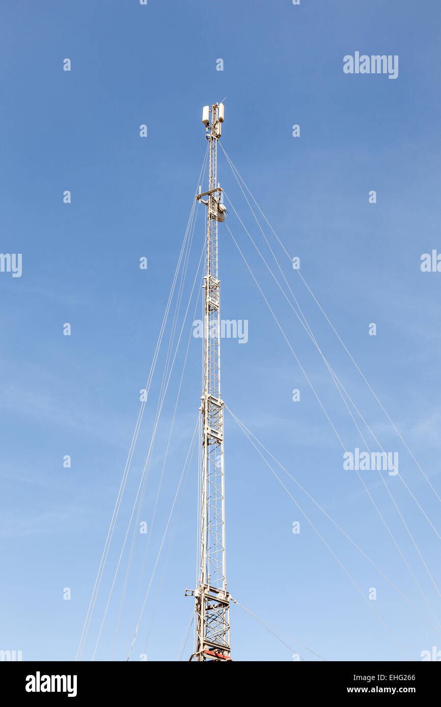 Mobile communication tower with cellular antennas Stock Photo
