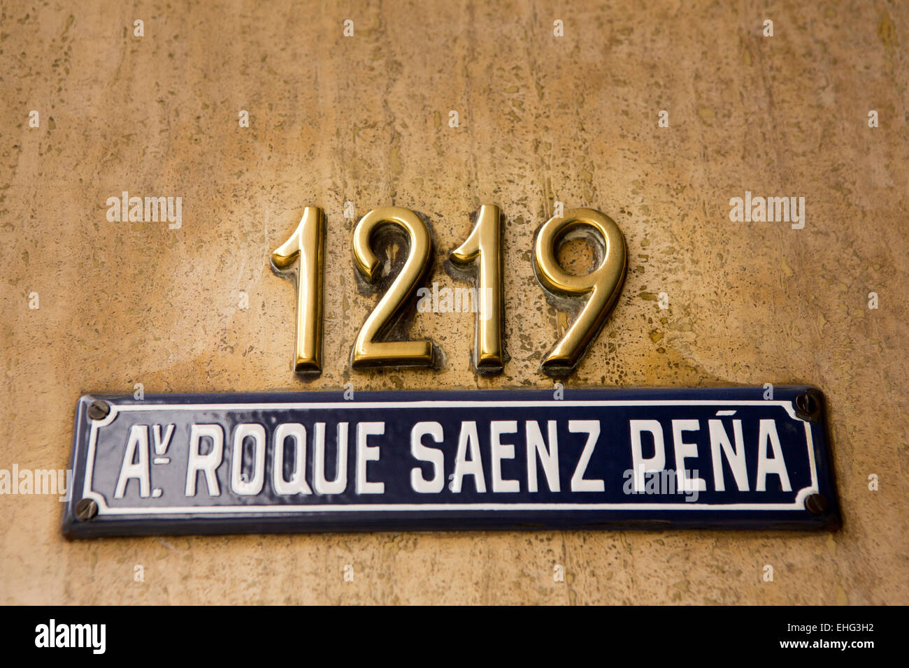 Argentina, Buenos Aires, 1219 Avenida Presidente Roque Sáenz Pena, house number and blue enameled road name sign Stock Photo