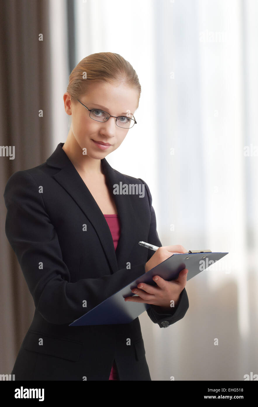 beautiful young business woman with folder Stock Photo - Alamy