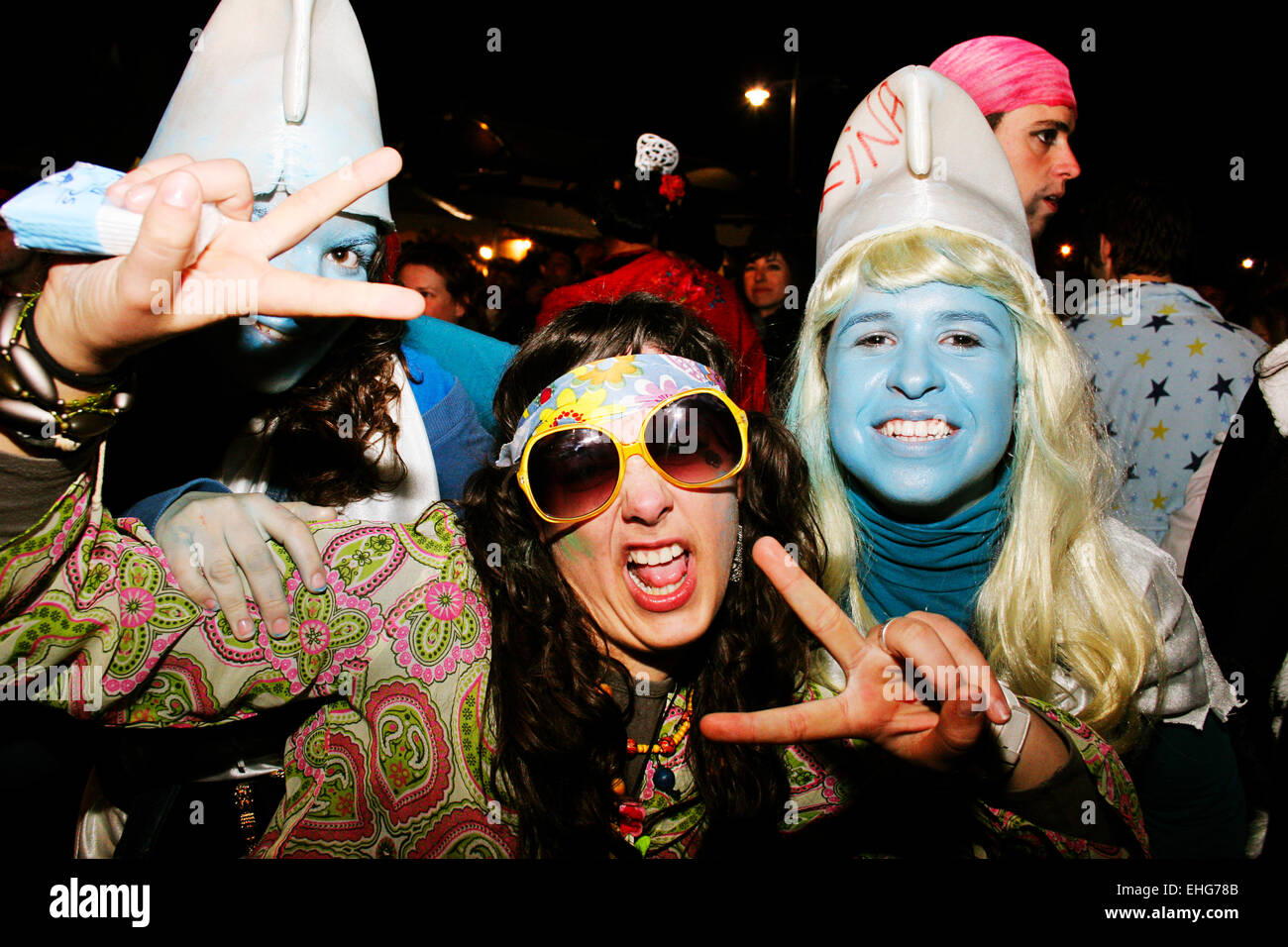 Hippy girl and Smurfs at the Pego festival Spain. Stock Photo