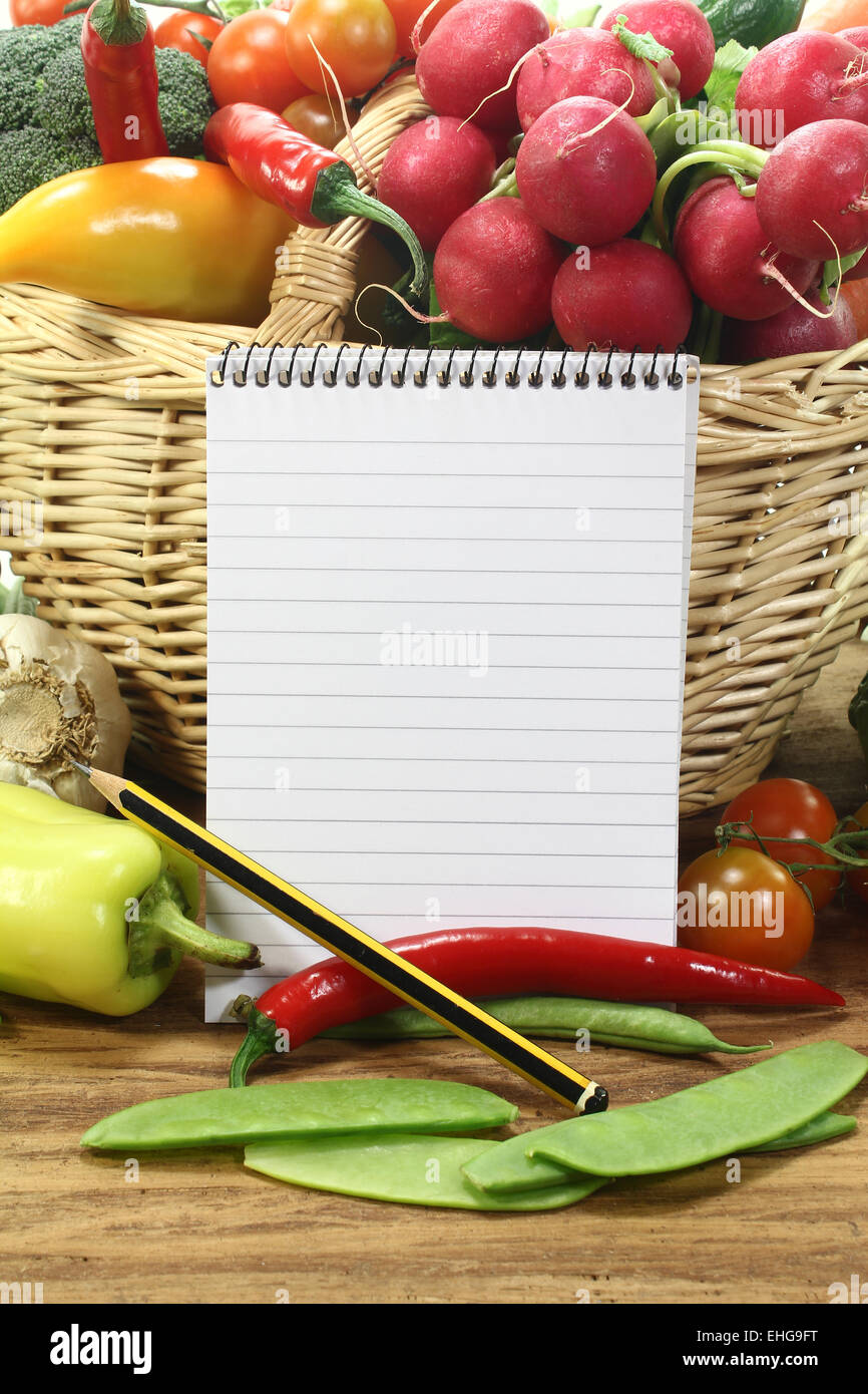 Purchasing paper with fresh vegetables Stock Photo - Alamy