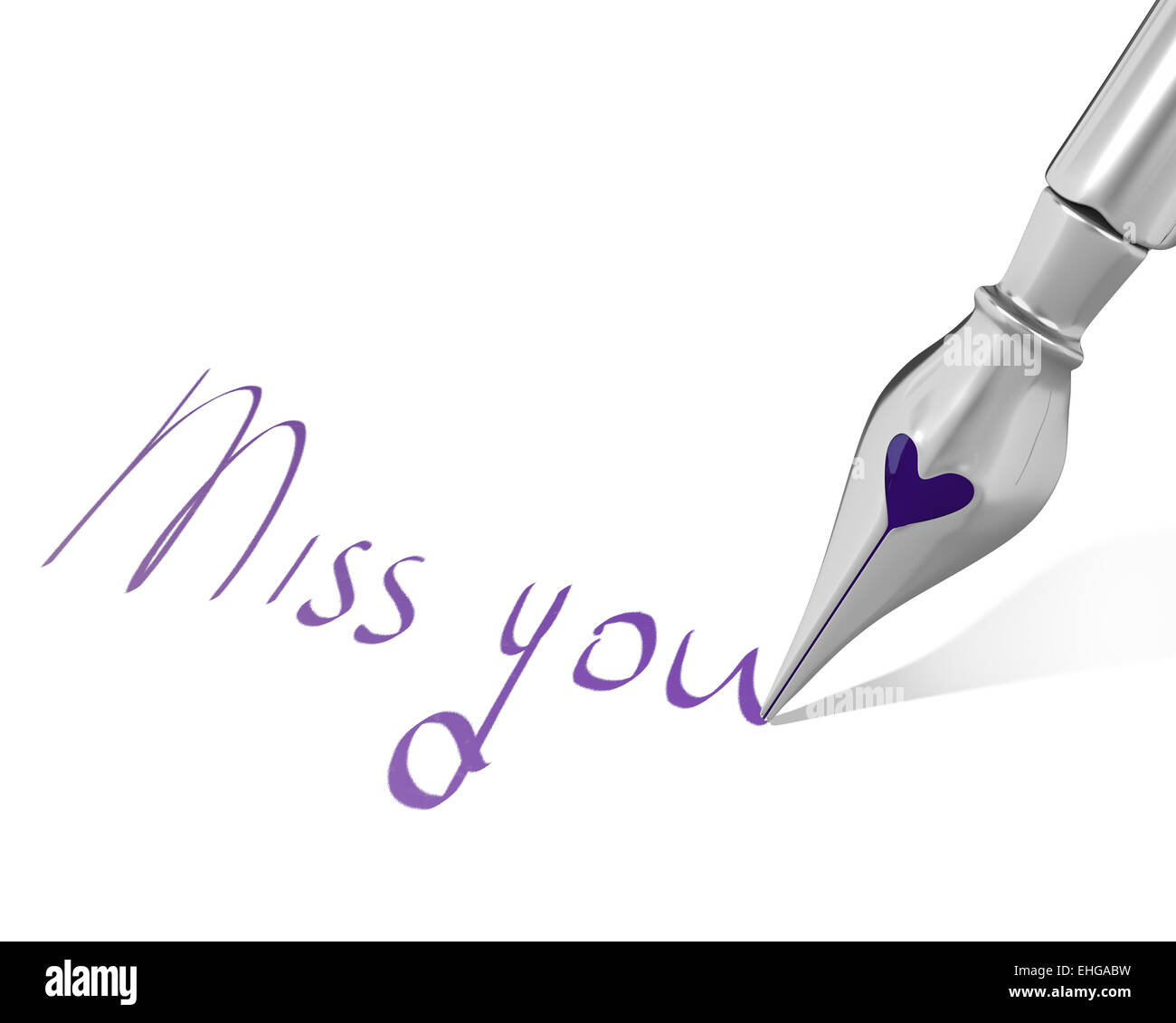 Ink pen nib with heart writes Miss you Stock Photo