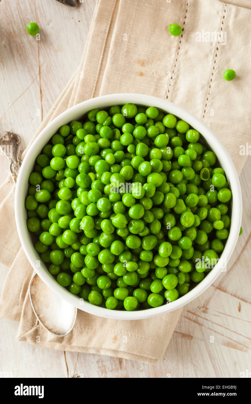 Organic Steamed Fresh Green Peas in a Bowl Stock Photo