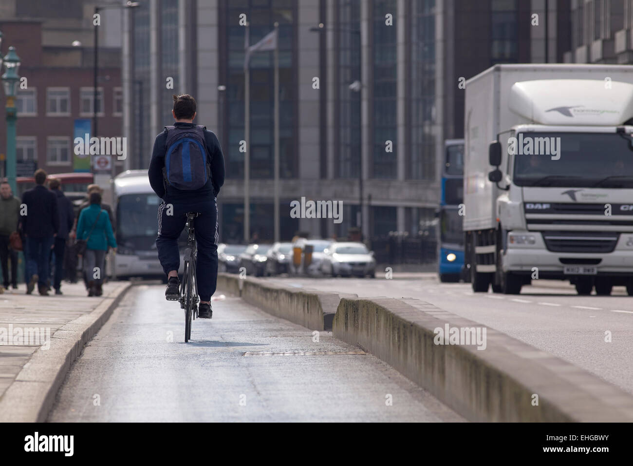 Cyclist on the  Cycle Superhighway crossing Southwark Bridge, London,UK. Stock Photo