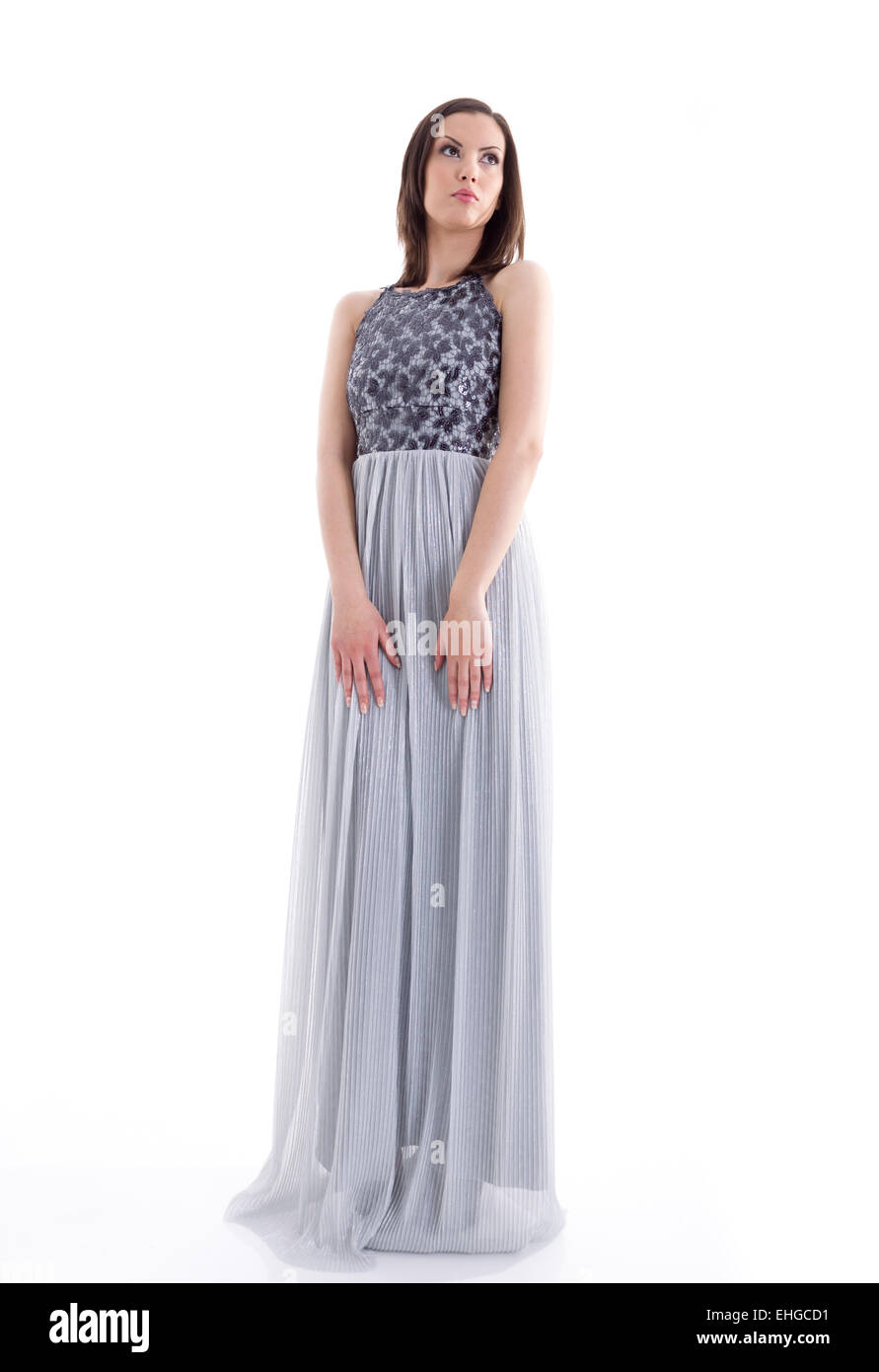 Beautiful woman in a gray dress posing for a photo shoot Stock Photo ...