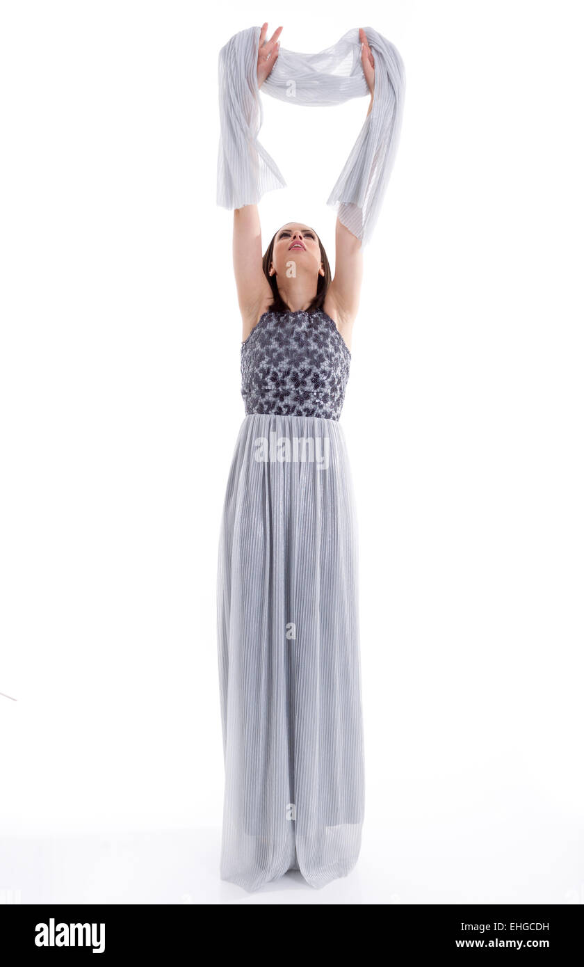 Beautiful woman in a gray dress posing for a photo shoot Stock Photo ...