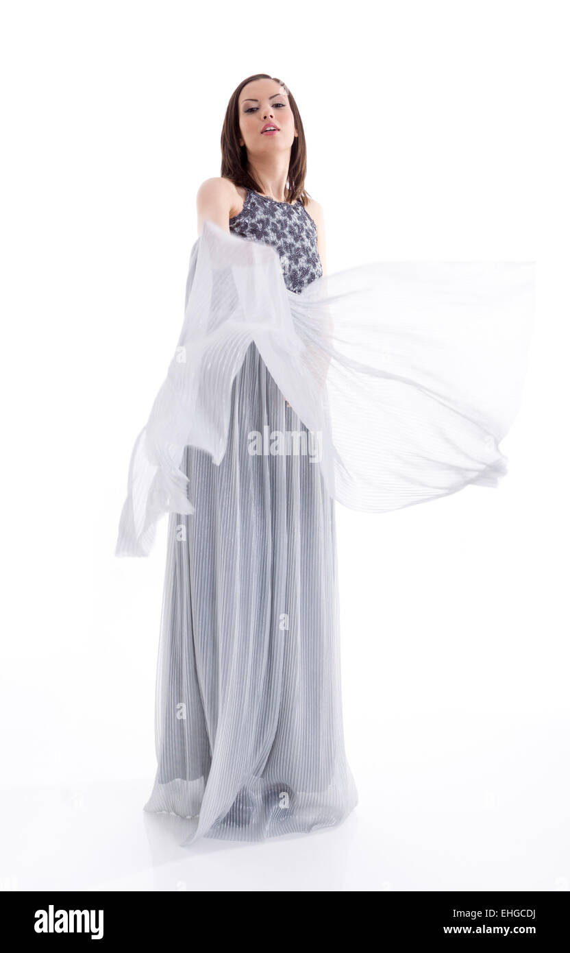 Beautiful woman in a gray dress posing for a photo shoot Stock Photo ...