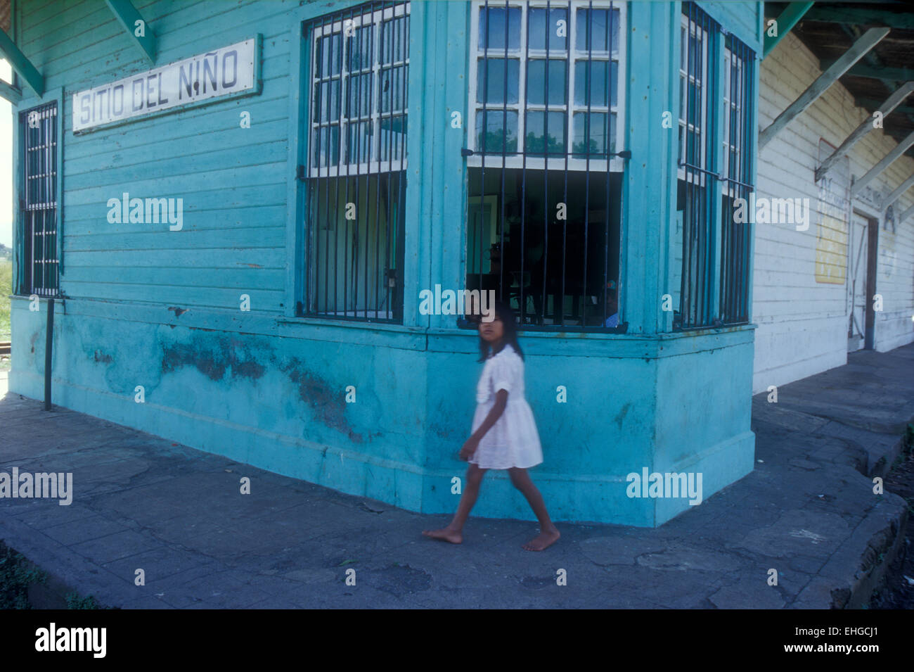 Barefoot girl striding past the Sitio del Niño train station in rural El  Salvador, Central America Stock Photo - Alamy