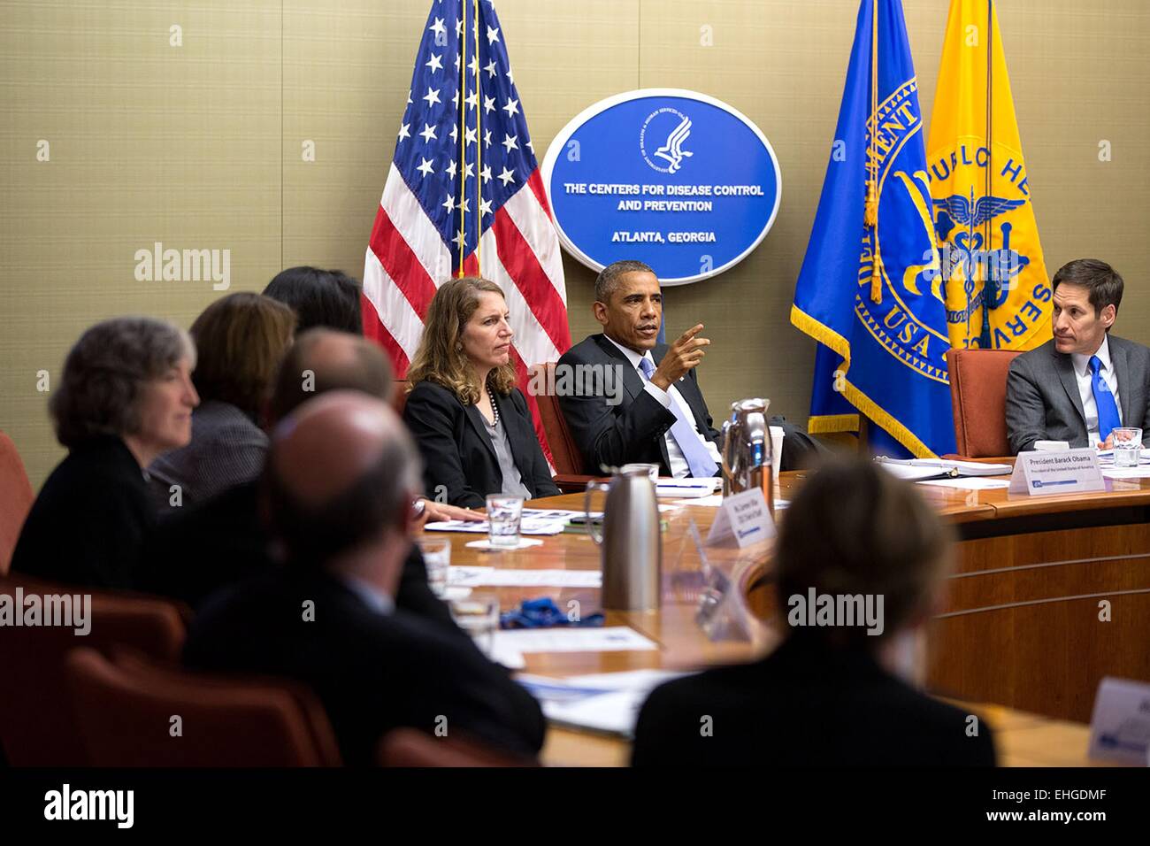 US President Barack Obama speaks during a briefing on the Ebola epidemic in West Africa at the headquarters of the Centers for Disease Control and Prevention  September 16, 2014 in Atlanta, Georgia. The President is seated between Health and Human Services Secretary Sylvia Mathews Burwell, and Dr. Tom Frieden, Director, Centers for Disease Control and Prevention. Stock Photo