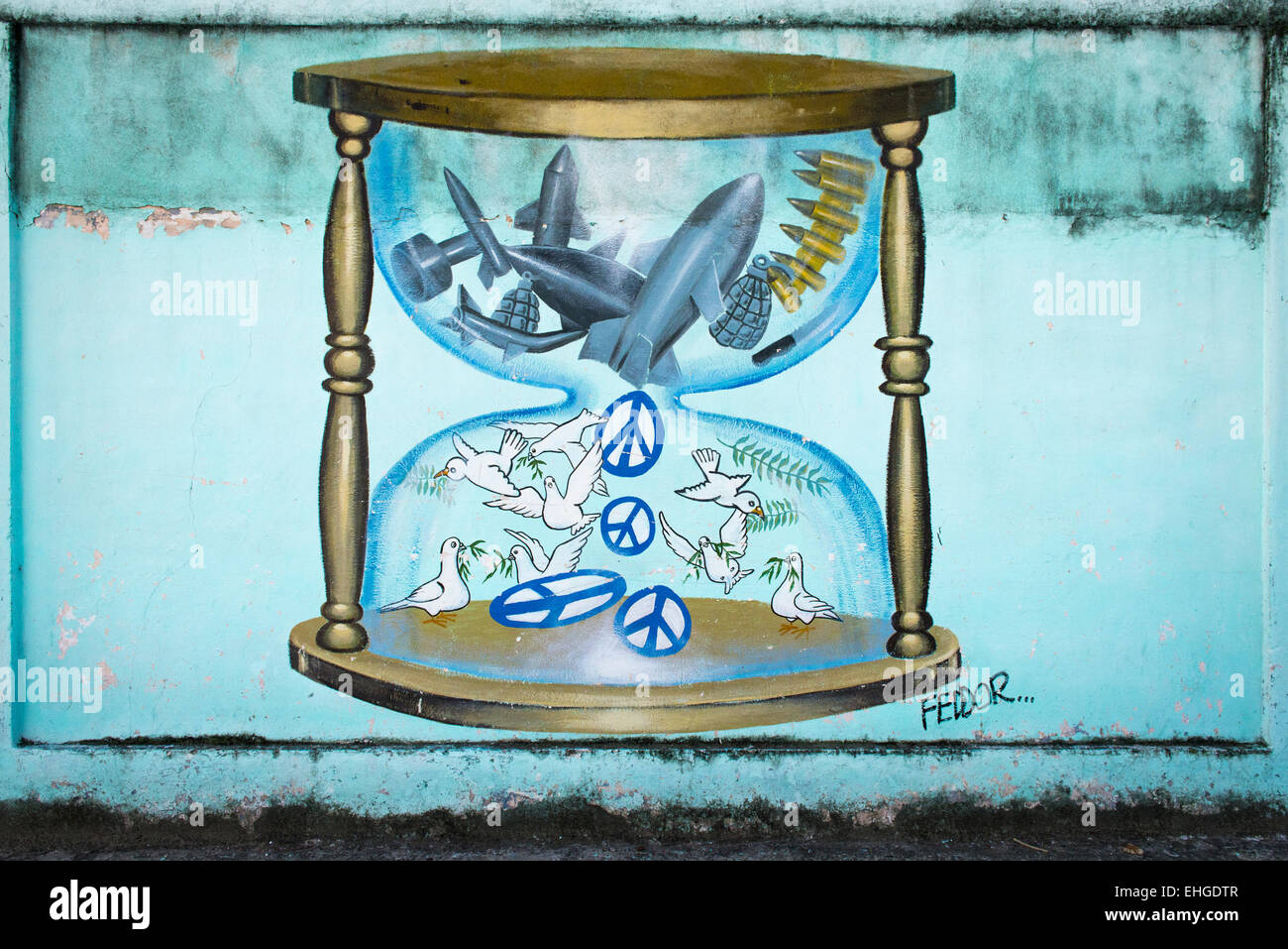 Cuba Santa Clara series of political extreme anti US USA North American cartoon cartoons murals on walls hourglass bombs doves Stock Photo