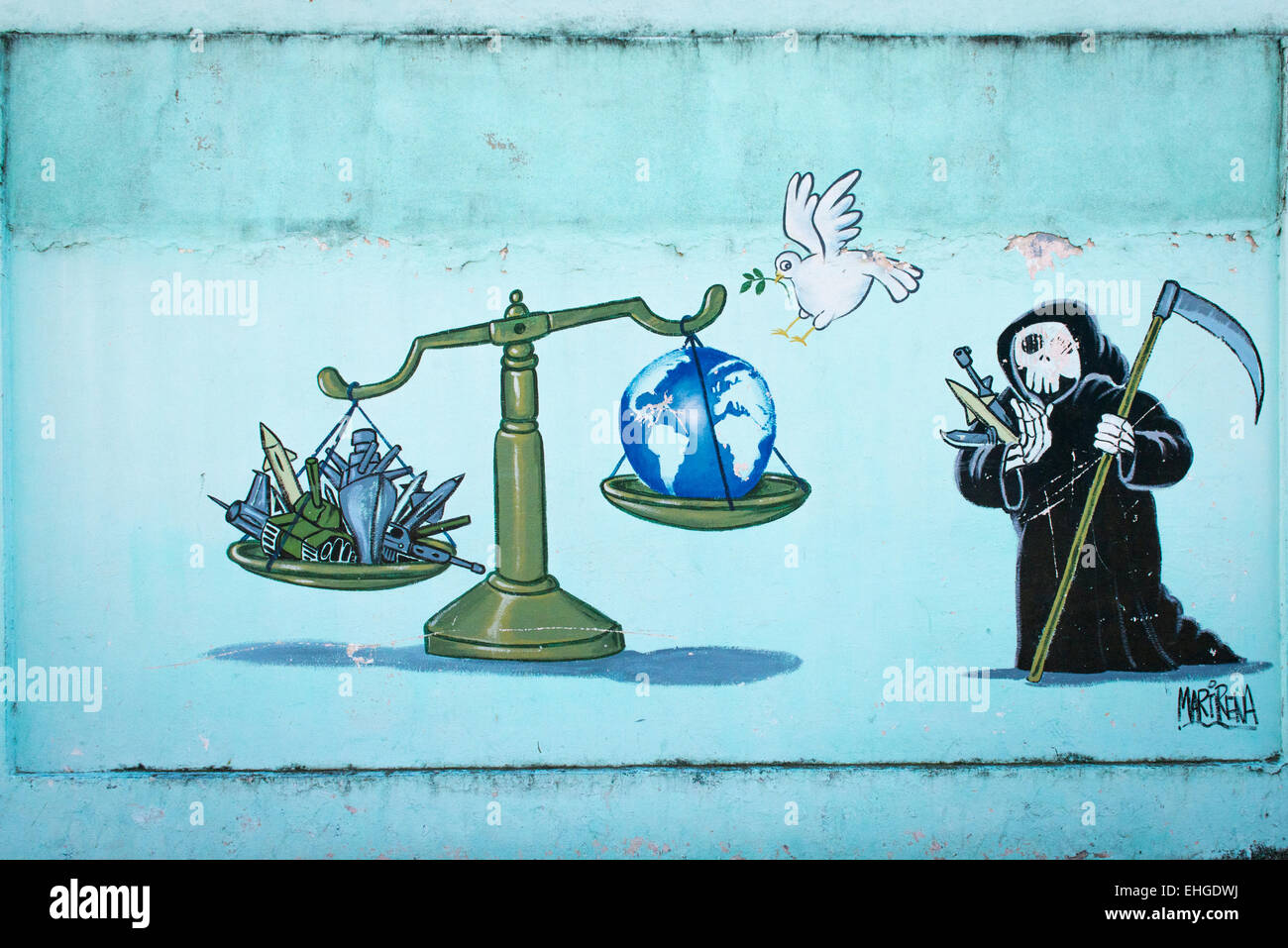 Cuba Santa Clara series of political extreme anti US USA North American cartoon cartoons murals on walls scales arms vs peace Stock Photo