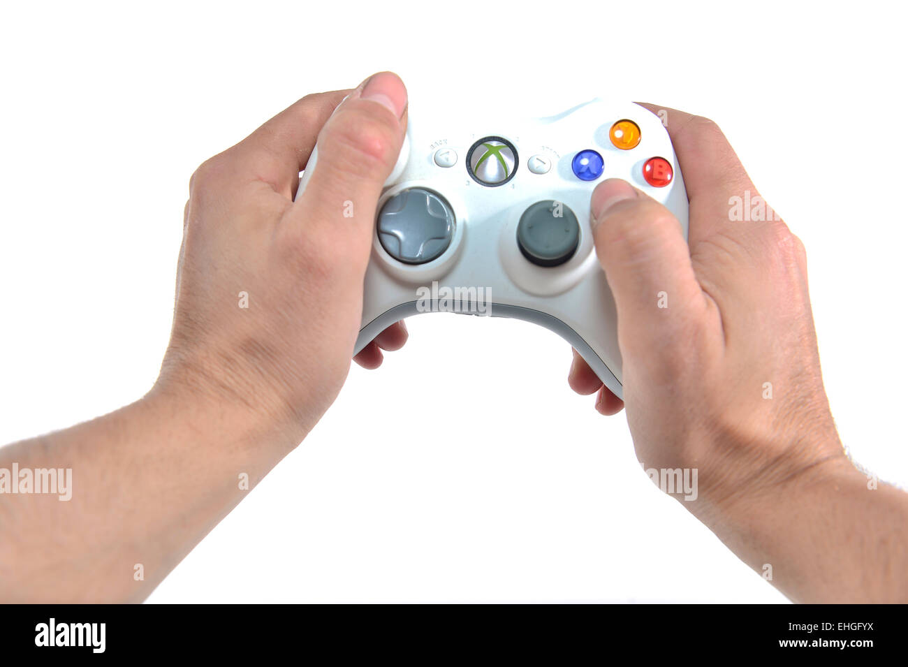 first person view of a person playing with an xbox 360 Microsoft controller Stock Photo