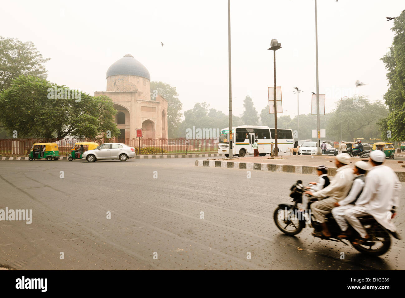 Four persons on a motorbike near Nizamuddin, New Delhi. Stock Photo