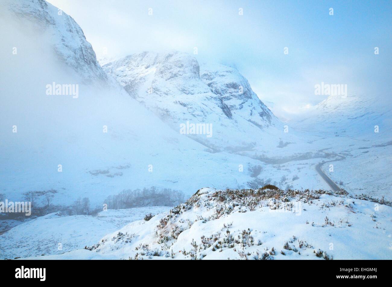 Glencoe ,Scottish Highlands the 'thee sisters covered in winter snow and cloud Stock Photo