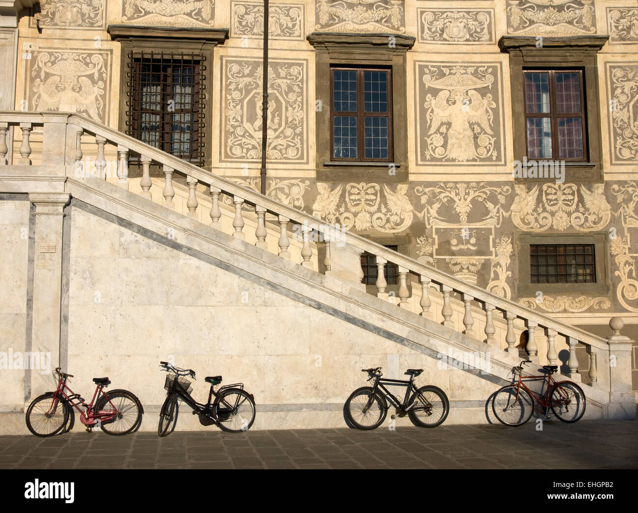 Students bikes outside Scuola Normale Superiore, Pisa University in Palazzo della Carovana, Piazza dei Cavalieri, Pisa, Italy. Stock Photo