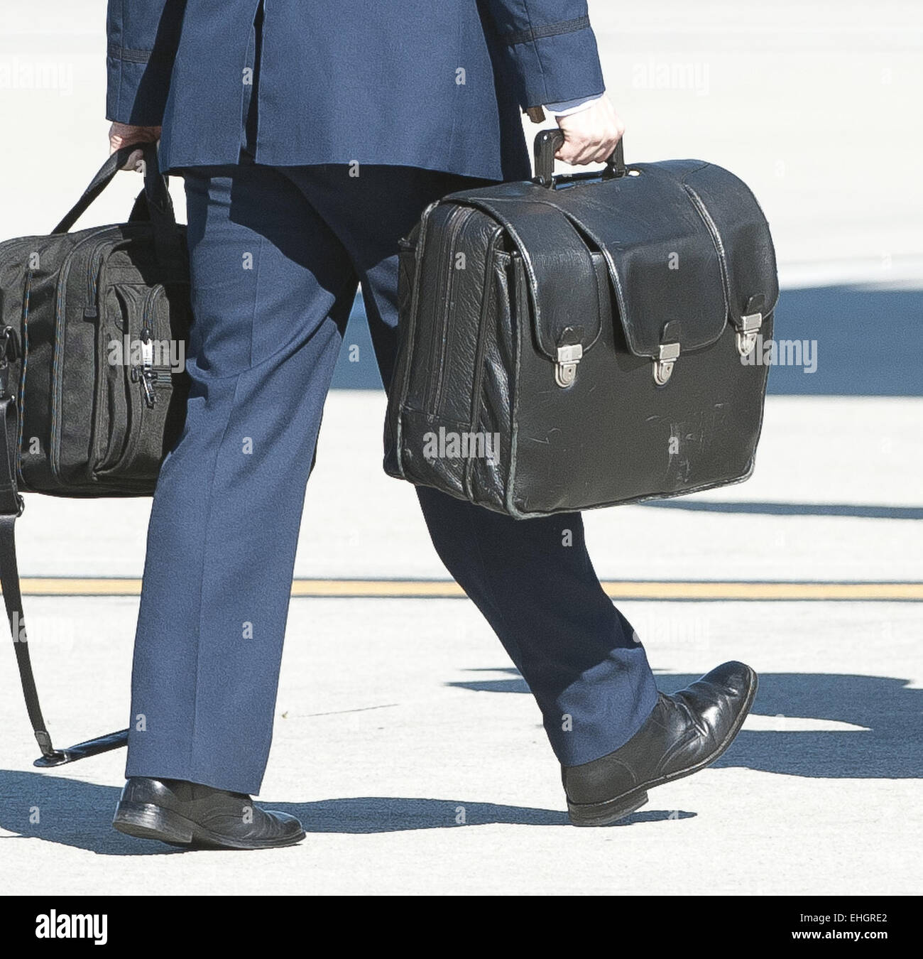 Los Angeles, California, USA. 13th Mar, 2015. A military aide, exchanging the duty among all branches of the US Armed Forces, accompanies all US presidents at all times outside of any fixed command center with a leather briefcase nicknamed the ''football.'' The 'football' is a leather briefcase or jacket holding a Zero Halliburton metal case, weighing about 45 lbs, that holds all the information and communication equipment to activate and launch the US nuclear arsenal. Credit:  ZUMA Press, Inc./Alamy Live News Stock Photo