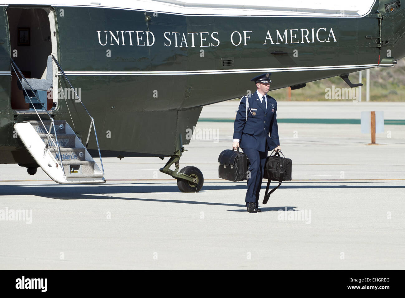 Los Angeles, California, USA. 13th Mar, 2015. A military aide, exchanging the duty among all branches of the US Armed Forces, accompanies all US presidents at all times outside of any fixed command center with a leather briefcase nicknamed the ''football.'' The 'football' is a leather briefcase or jacket holding a Zero Halliburton metal case, weighing about 45 lbs, that holds all the information and communication equipment to activate and launch the US nuclear arsenal. Credit:  ZUMA Press, Inc./Alamy Live News Stock Photo