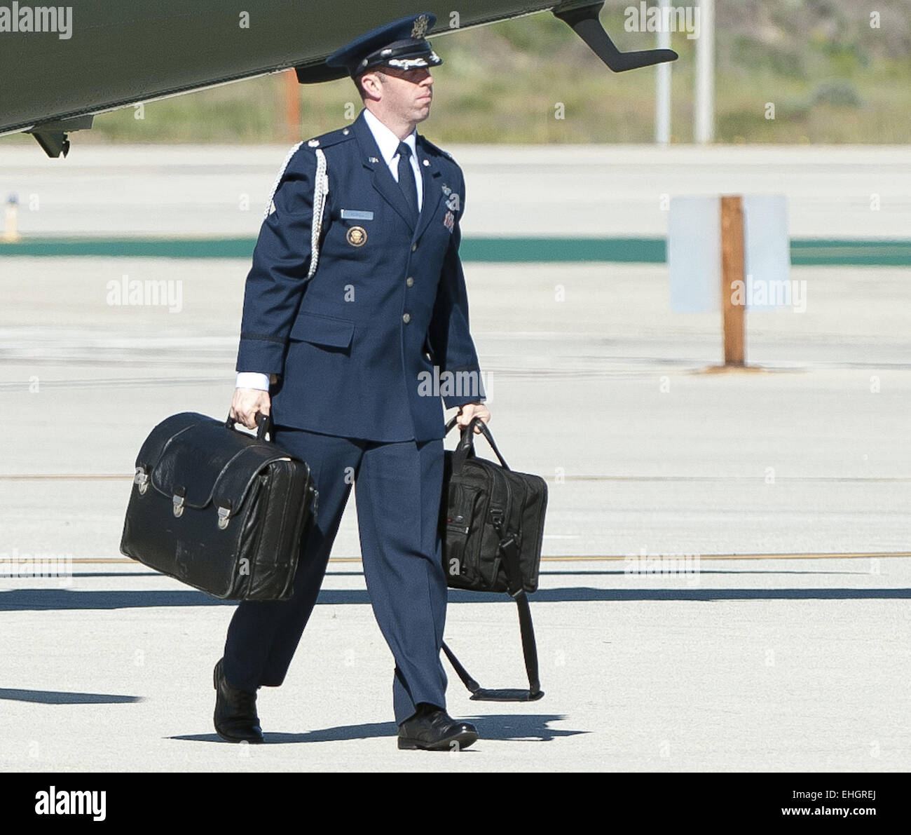 Los Angeles, California, USA. 13th Mar, 2015. A military aide, exchanging  the duty among all branches of the US Armed Forces, accompanies all US  presidents at all times outside of any fixed