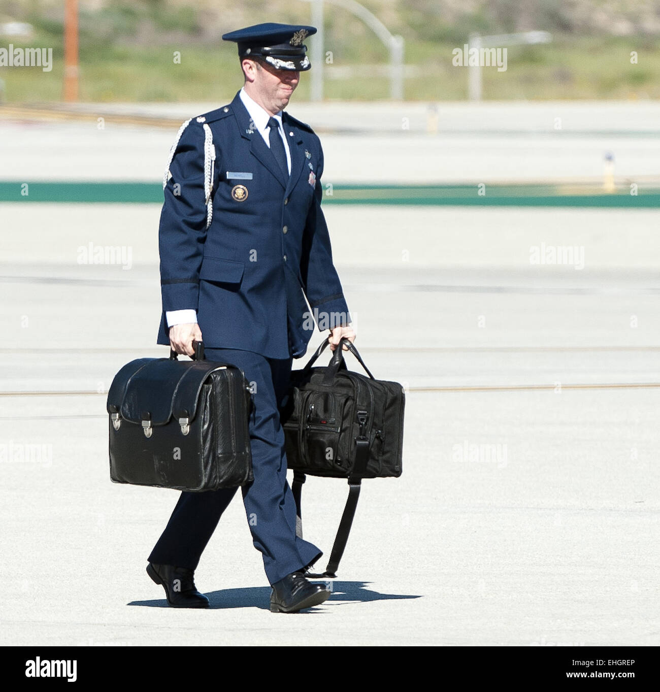 Los Angeles, California, USA. 13th Mar, 2015. A military aide, exchanging the duty among all branches of the US Armed Forces, accompanies all US presidents at all times outside of any fixed command center with a leather briefcase nicknamed the ''football.'' The 'football' is a leather briefcase or jacket holding a Zero Halliburton metal case, weighing about 45 lbs, that holds all the information and communication equipment to activate and launch the US nuclear arsenal. Credit:  ZUMA Press, Inc./Alamy Live News Stock Photo