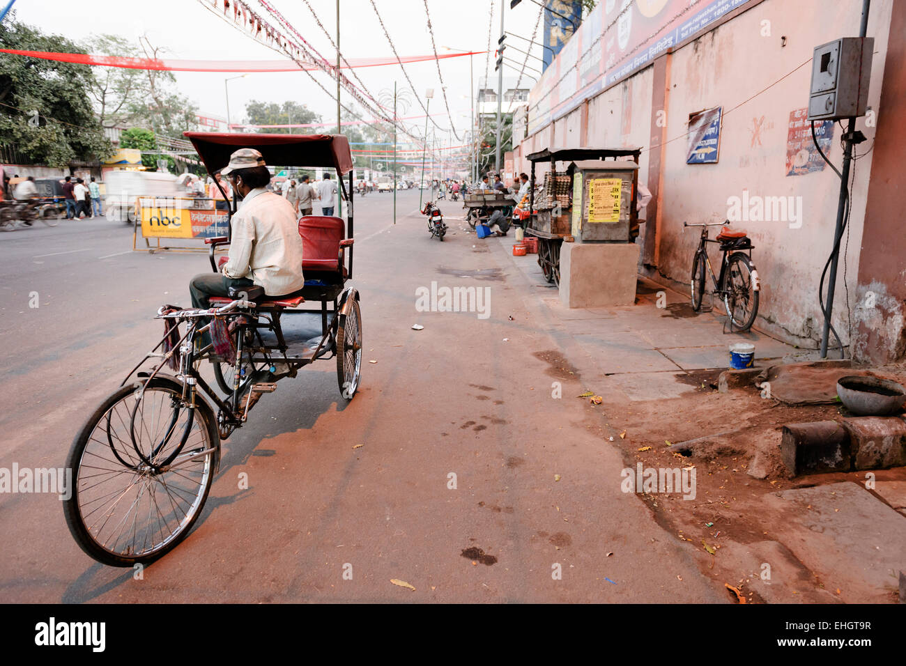 A rickshaw driver having a rest in the streets of Jaipur. Stock Photo
