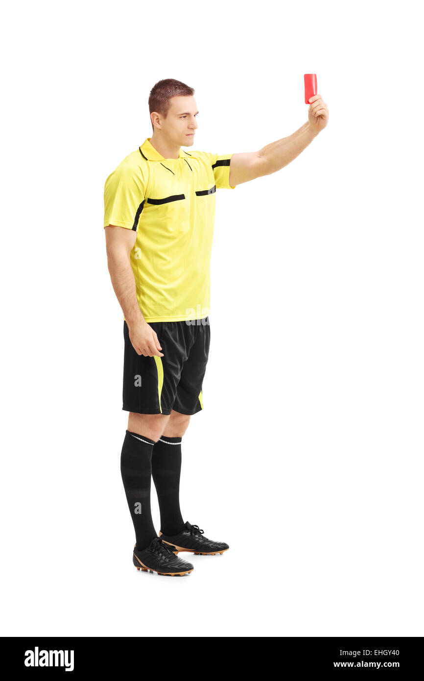 Full length portrait of a football referee showing a red card isolated on white background Stock Photo