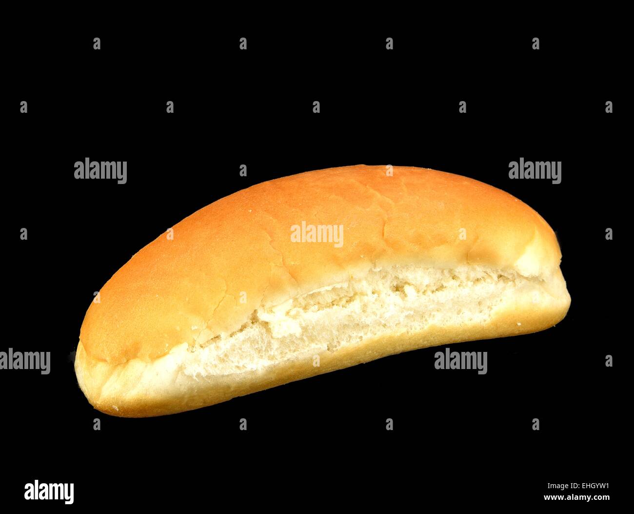 Hot dog bun on a black background. Stock Photo