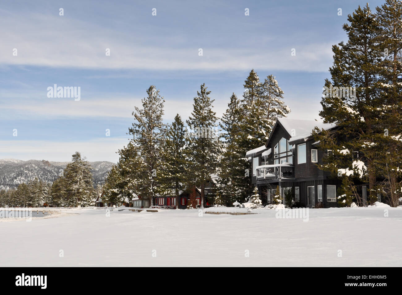 Cabin in Snow with Mountains in Background Stock Photo - Alamy