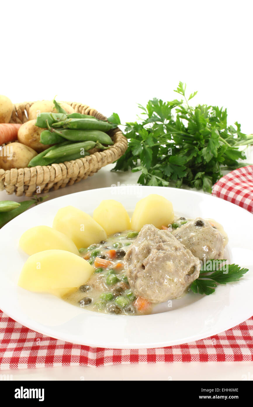 fresh cooked meatballs in a white sauce with caper Stock Photo