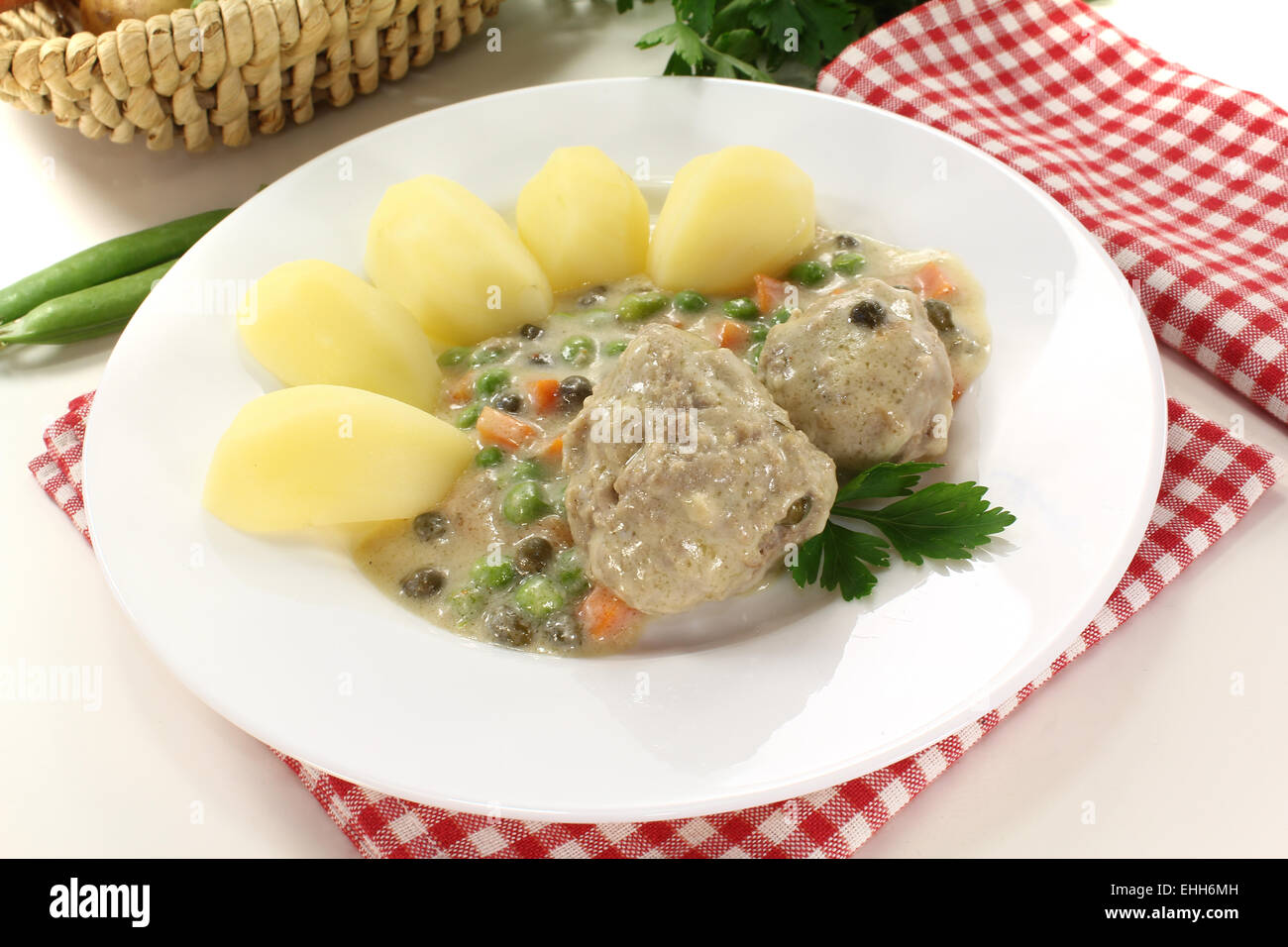 delicious cooked meatballs in a white sauce Stock Photo