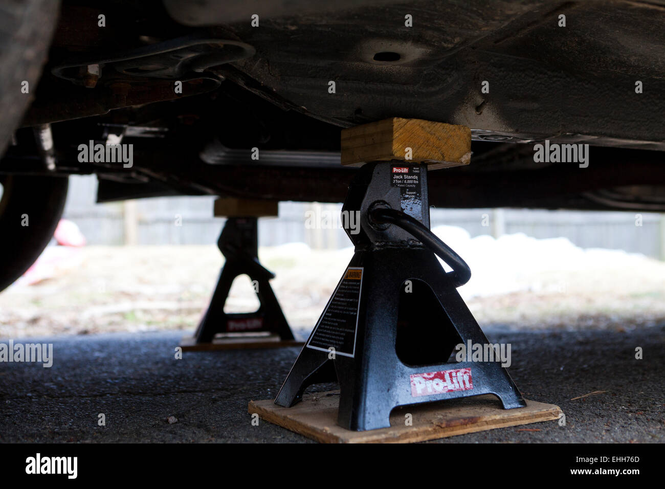 Car on jack stands for repair - USA Stock Photo